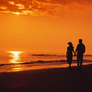 Couple walking at sunset